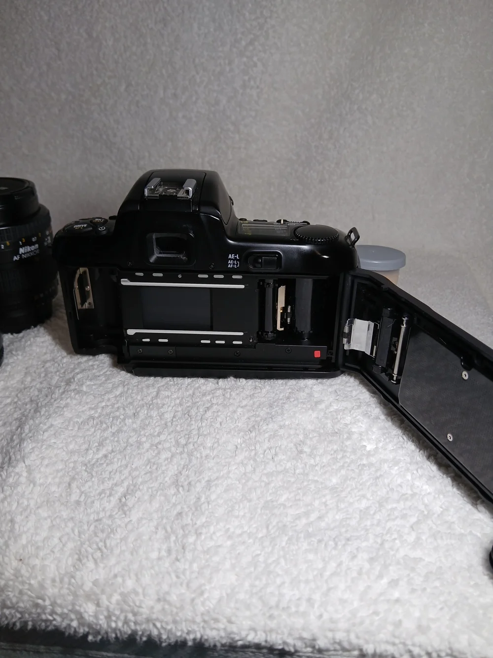 Nikon N6006 35mm autofocus SLR film camera. With Extra Lens and 2 Rolls Of Film.